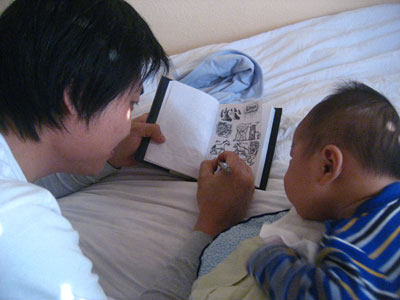 Elijah watching his dad draw and dad drawing pictures for his son. I cherish this moment